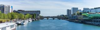 The small river in the center of Paris with fashion institute on the right 