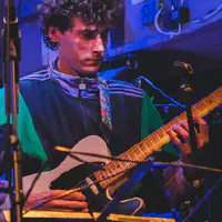 Jean-Loup (I hope, there is no credits on line) playing guitar