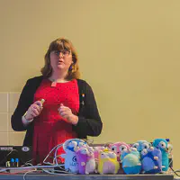 Presentation of the State of GO 2026, with many Gophers plushies on the desk up front.
