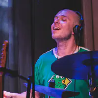 Mackwood enjoying playing drums