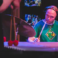 Mackwood playing drums