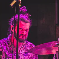 Drummer heavily concentrated in drumming