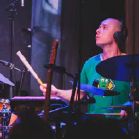 Mackwood playing drums